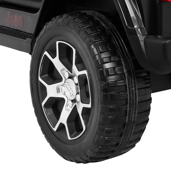 Jeep Wrangler Rubicon Batterie für Kinder schwarz + Fernbedienung + MP3 LED Radio + EVA Räder