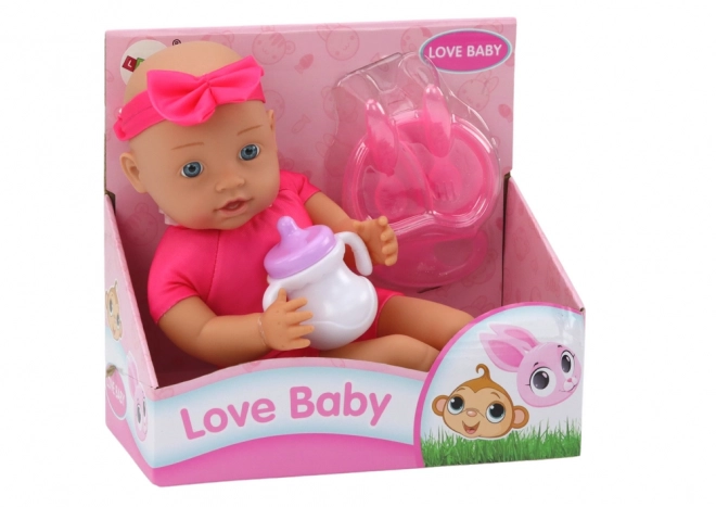 Babypuppe mit Fütterungszubehör in Rosa