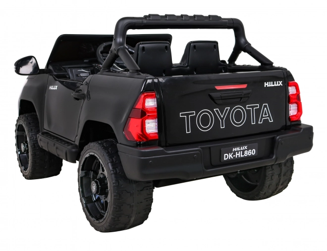 Toyota Hilux Batterie für Kinder schwarz + Antrieb 4x4 + Fernbedienung + 2 Gepäckträger + MP3-Radio + LED-Diode
