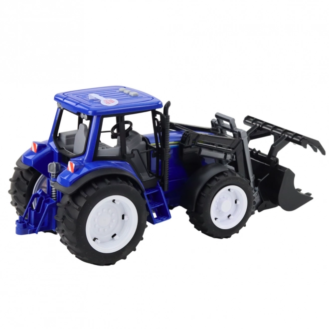 Kindlicher Traktor mit beweglicher Schaufel blau