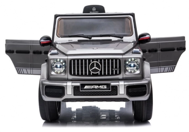 Silberner Mercedes G63 AMG Elektroauto für Kinder