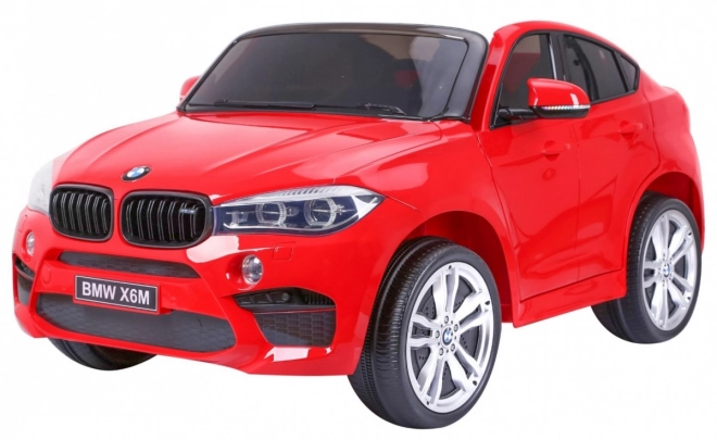 BMW X6M XXL pro 2 Kinder Rot + Fernbedienung + Ökoleder + Sicherheitsgurte + Langsamer Start + MP3 USB + LED-Leuchte