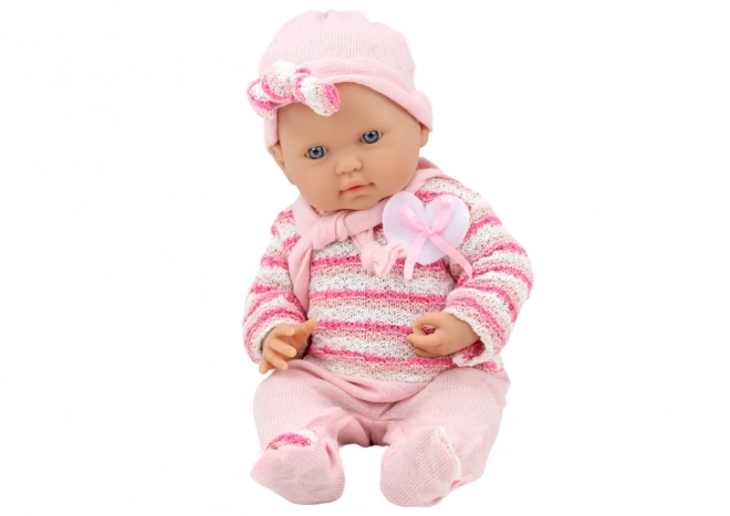 Baby Puppe mit gestreiftem Pullover, Mütze und Schal in Rosa