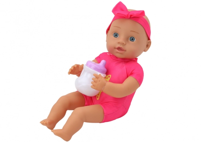 Babypuppe mit Fütterungszubehör in Rosa