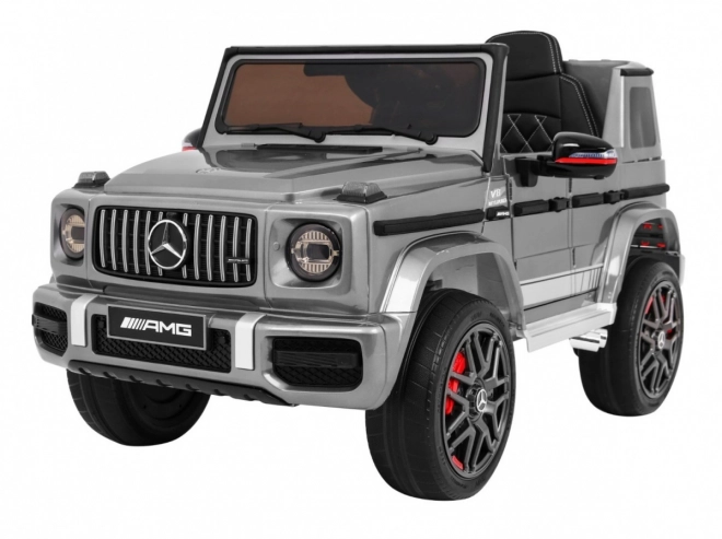 Mercedes AMG G63 für Kinder Silberlack + Fernbedienung + MP3 LED + langsamer Start + EVA + Gurte