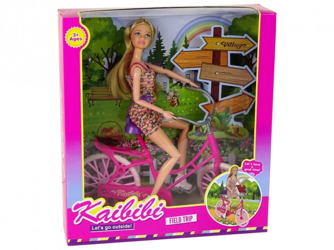 Puppe mit Fahrrad in Pink