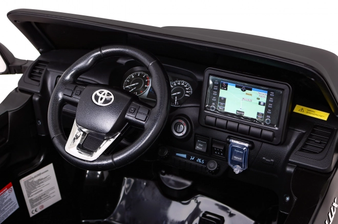 Toyota Hilux Batterie für Kinder schwarz + Antrieb 4x4 + Fernbedienung + 2 Gepäckträger + MP3-Radio + LED-Diode