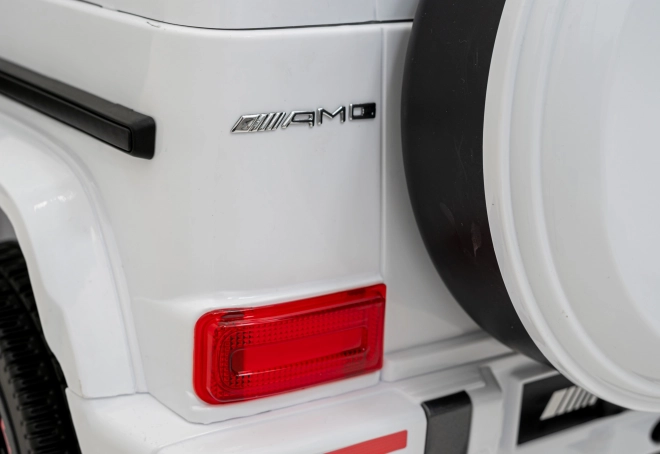 Mercedes AMG G63 für Kinder weiß + Fernbedienung + MP3 LED + langsamer Start + EVA + Gurte