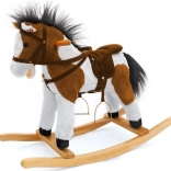 Braun-weißes Schaukelpferd