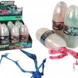 öffnendes Dinosaurier-Ei mit kristallinen Figuren