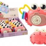 Rosa interaktiver Krebs mit Projektor und Rassel auf Batterien