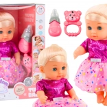 Puppe im rosa Kleid mit Fläschchen und Rassel, mit Geräuschen und Pipi-Funktion