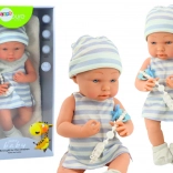 Puppe Baby in Weiß-blauem Outfit mit Mütze und Schnuller