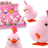 Rosa springendes Küken auf Schlüssel