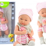 Stoffbaby in Weiß-Rosa Kleidung mit Mütze und Schnuller