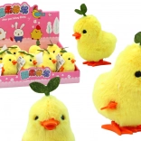 Gelbes aufziehbares Küken mit Blättchen